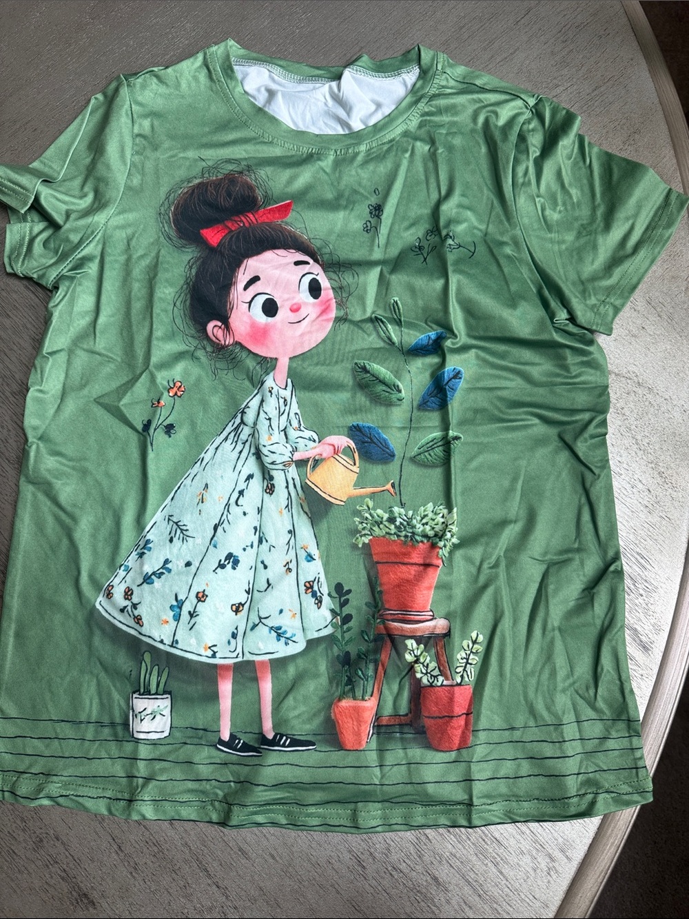 Green Short-Sleeve Graphic Tee with Watering Girl Print